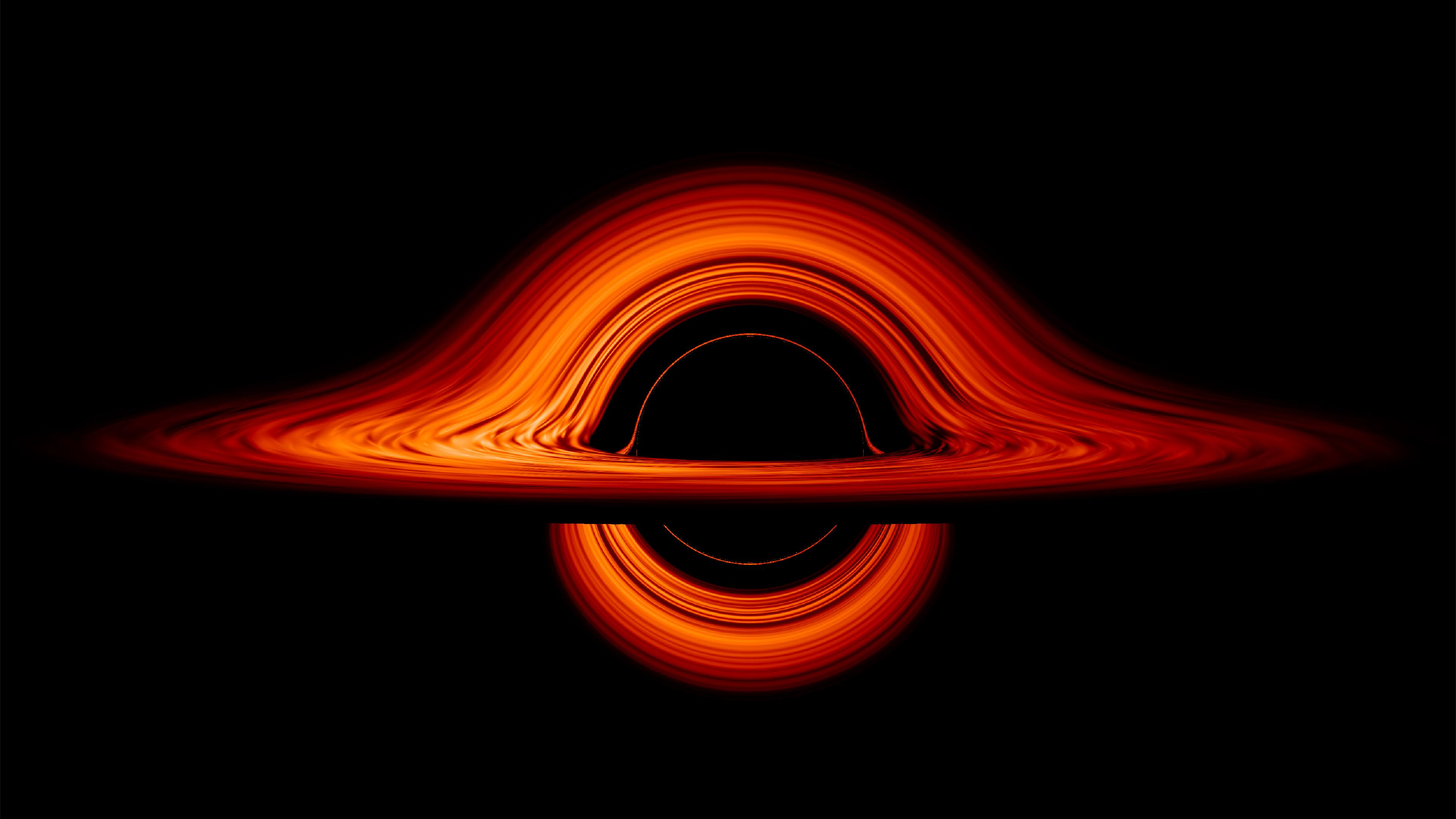 A black hole, bending light around its edge.